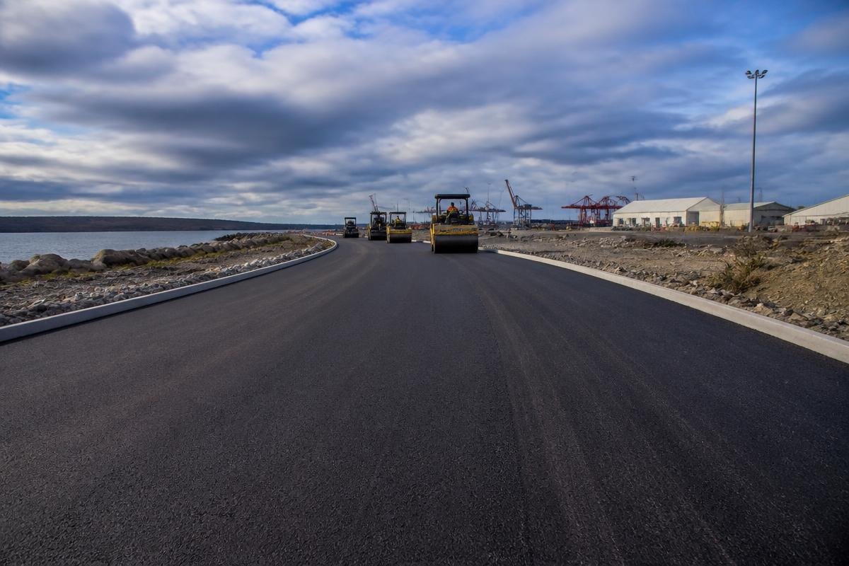 Fresh asphalt on a coastal commercial access road