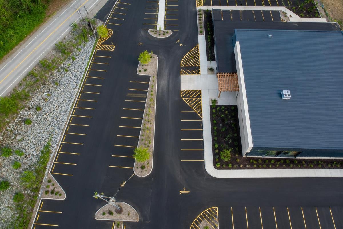 Aerial view of a precisely paved and marked parking area